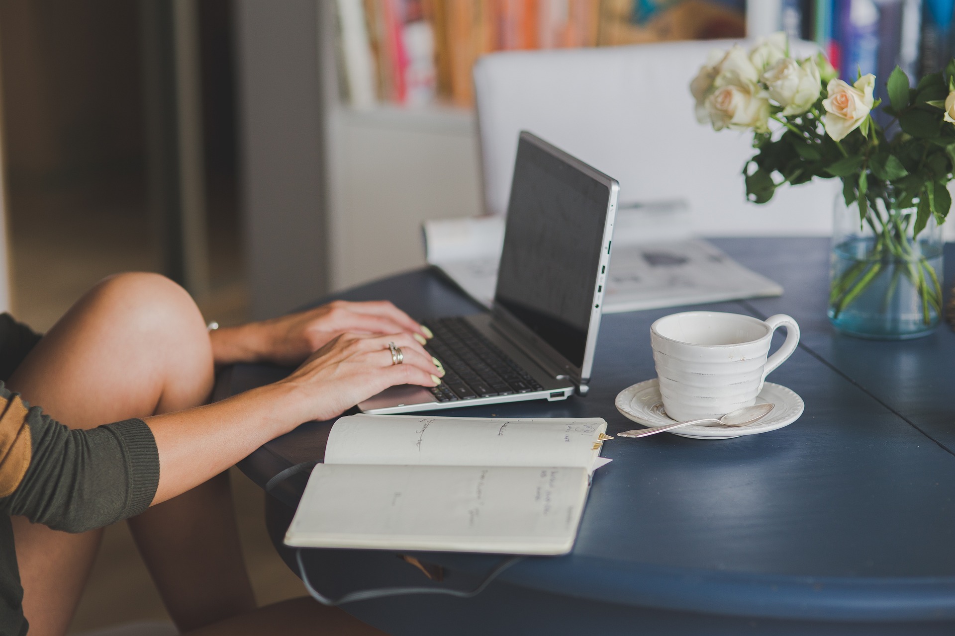 A phone placed face down on a desk to minimize distractions while working.