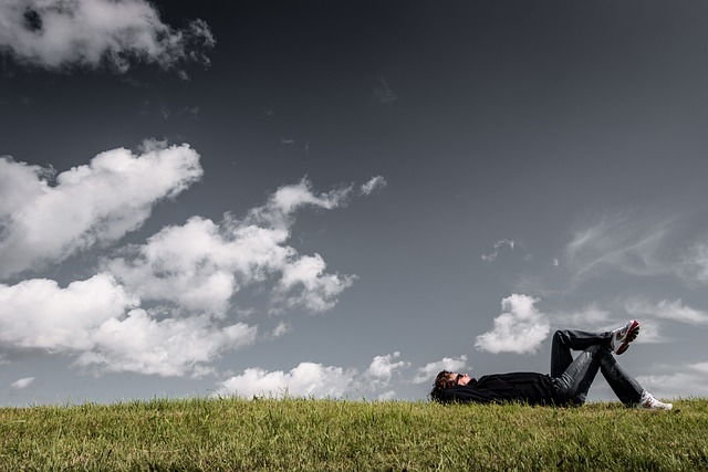 A person meditating in a quiet park